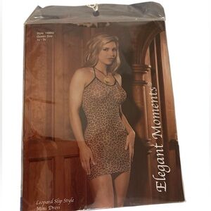 Sexy Elegant Moments Animal Print Sheer Mini Dress. New with tags in plastic.